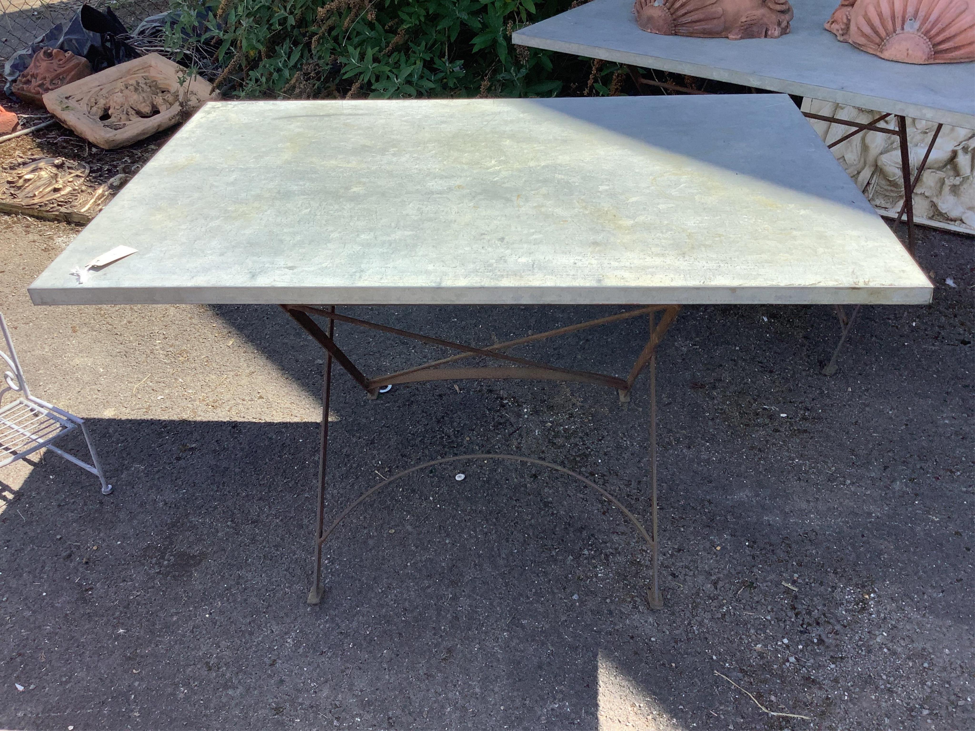 A rectangular zinc topped wrought iron garden table, width 120cm, depth 80cm, height 70cm